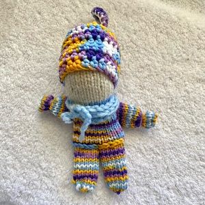 Adorable baby doll hand knit.